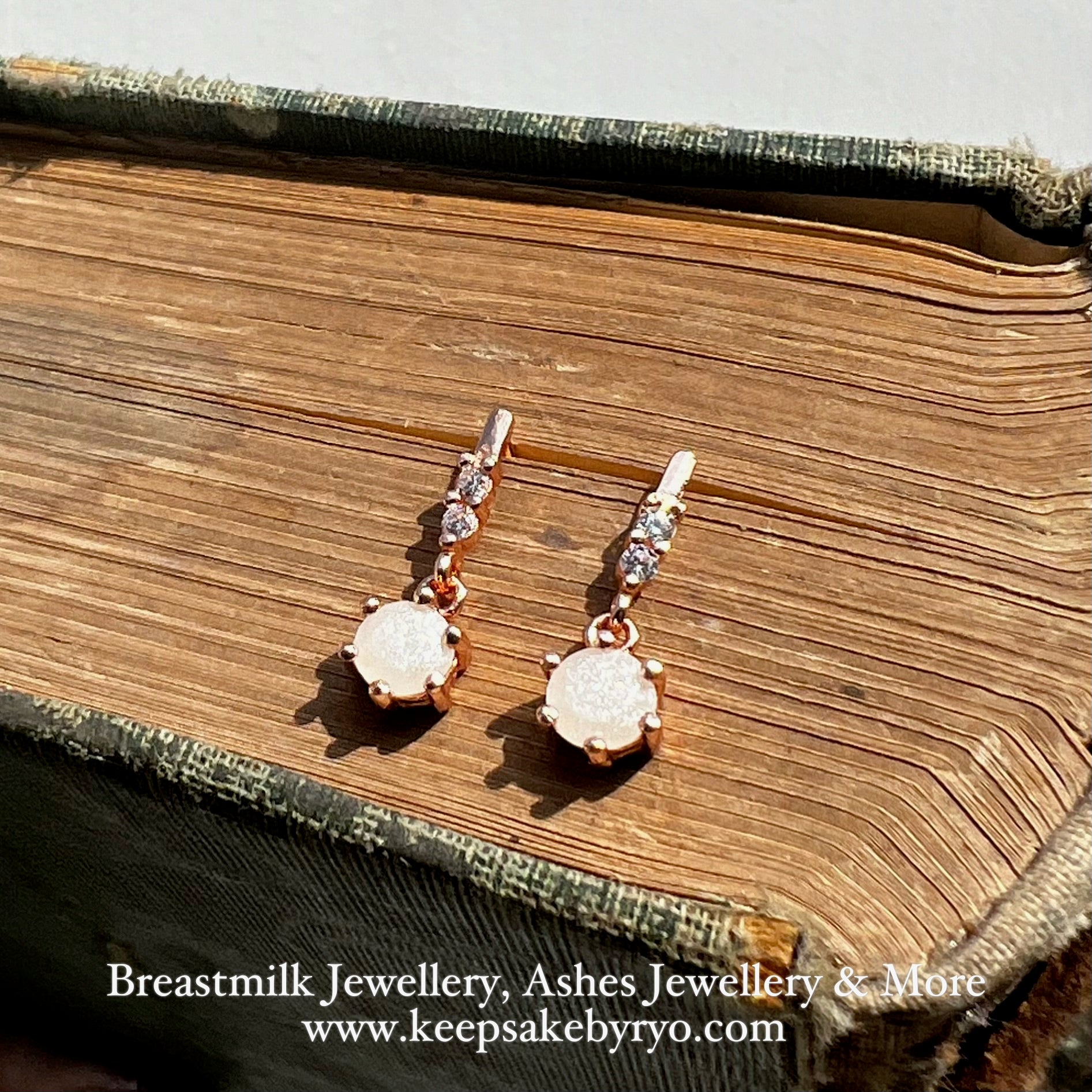 SOLITAIRE: CROWN DANGLING EAR STUDS