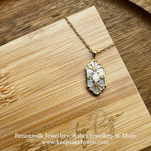 SOLITAIRE: MARIE MOTHER OF PEARL PENDANT WITH OVAL SHAPED SOLITAIRE