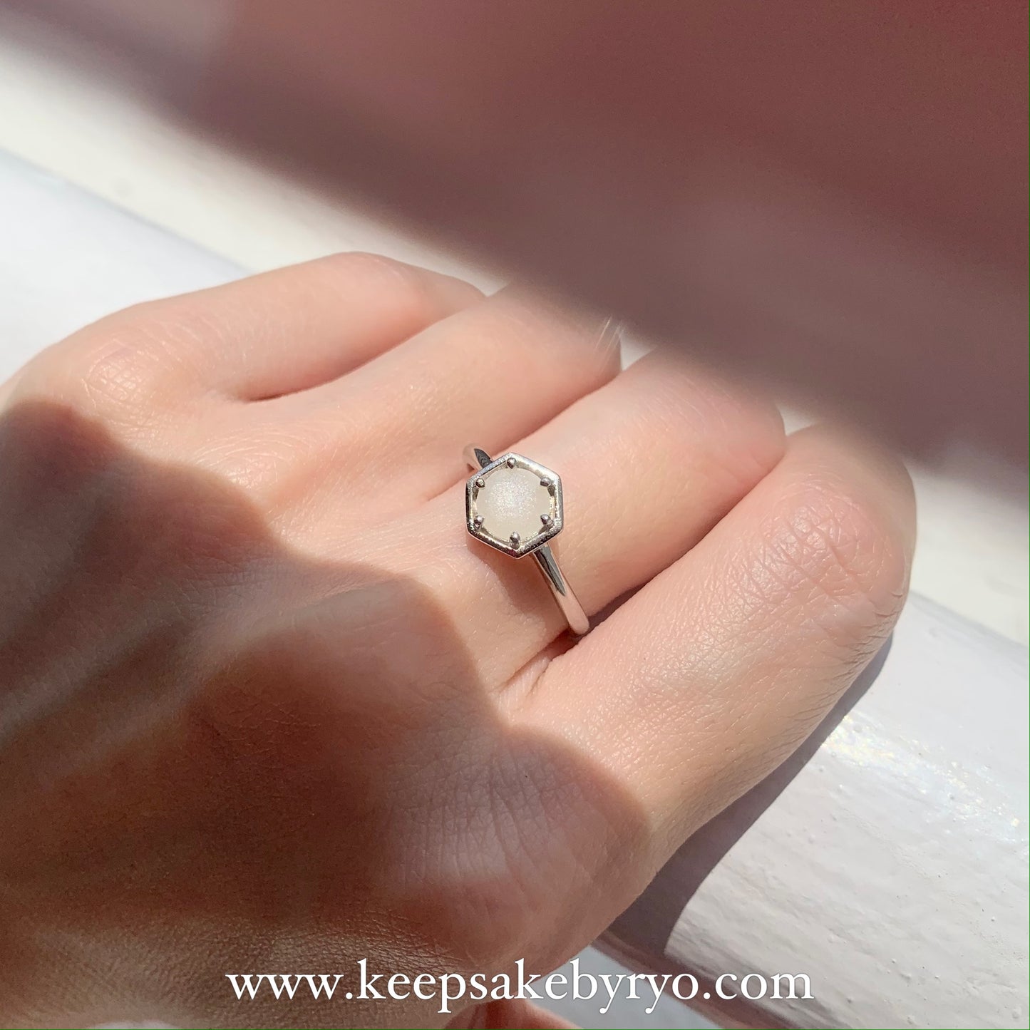 SOLITAIRE: HEXI RING WITH ROUND INCLUSION STONE