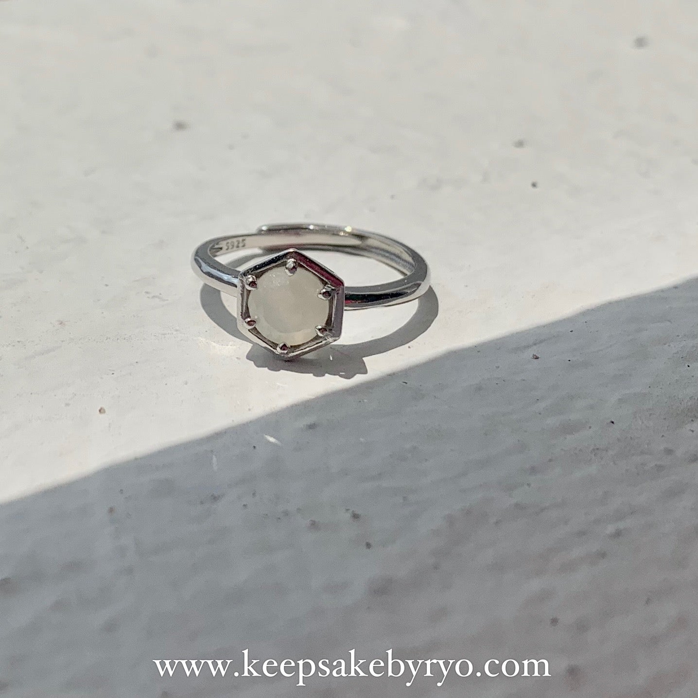 SOLITAIRE: HEXI RING WITH ROUND INCLUSION STONE